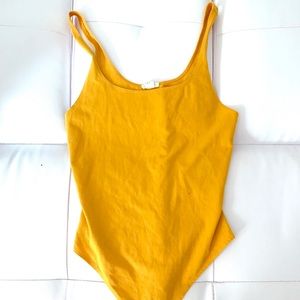 yellow bodysuit